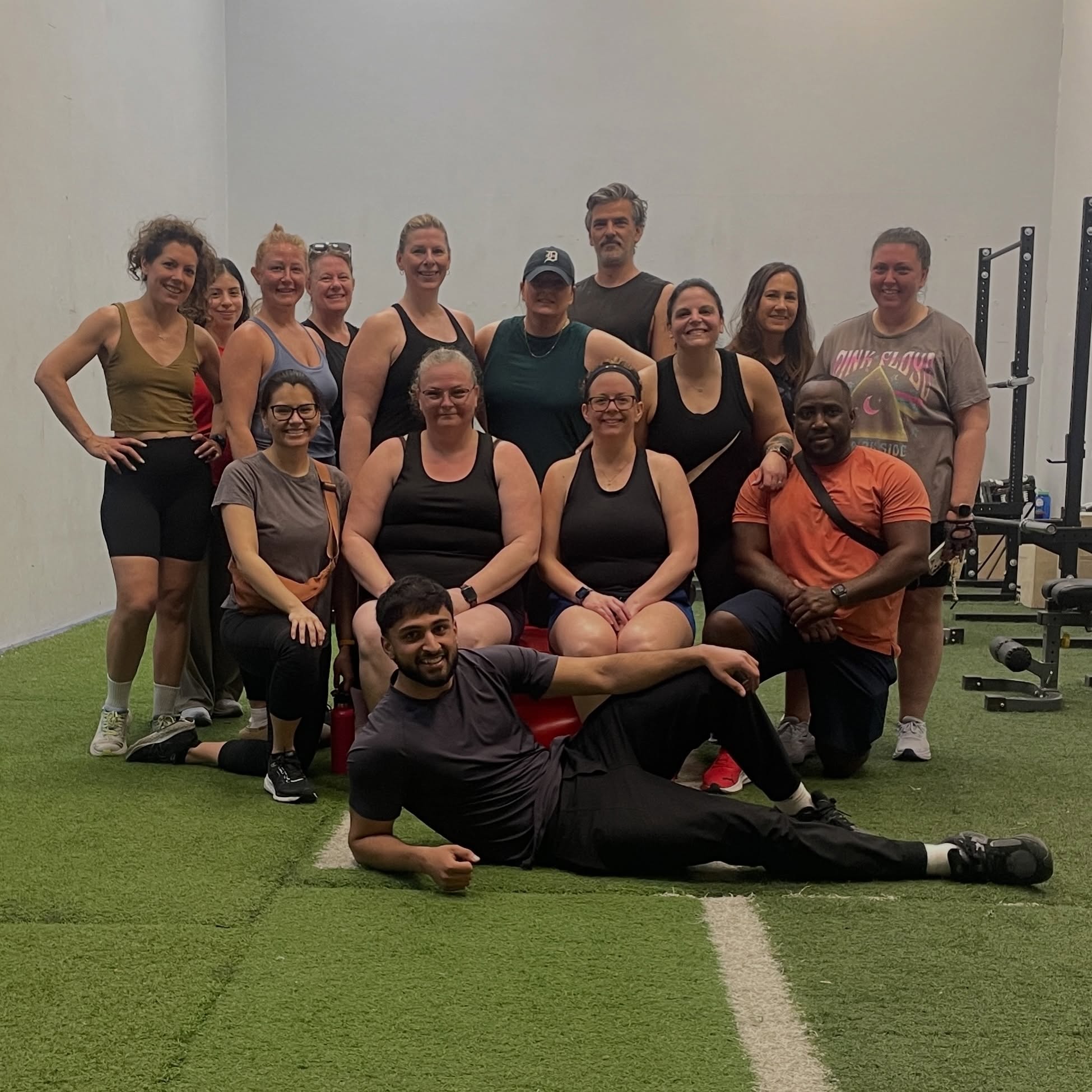 Enhanced members and coach together after a community group workout in London, Ontario